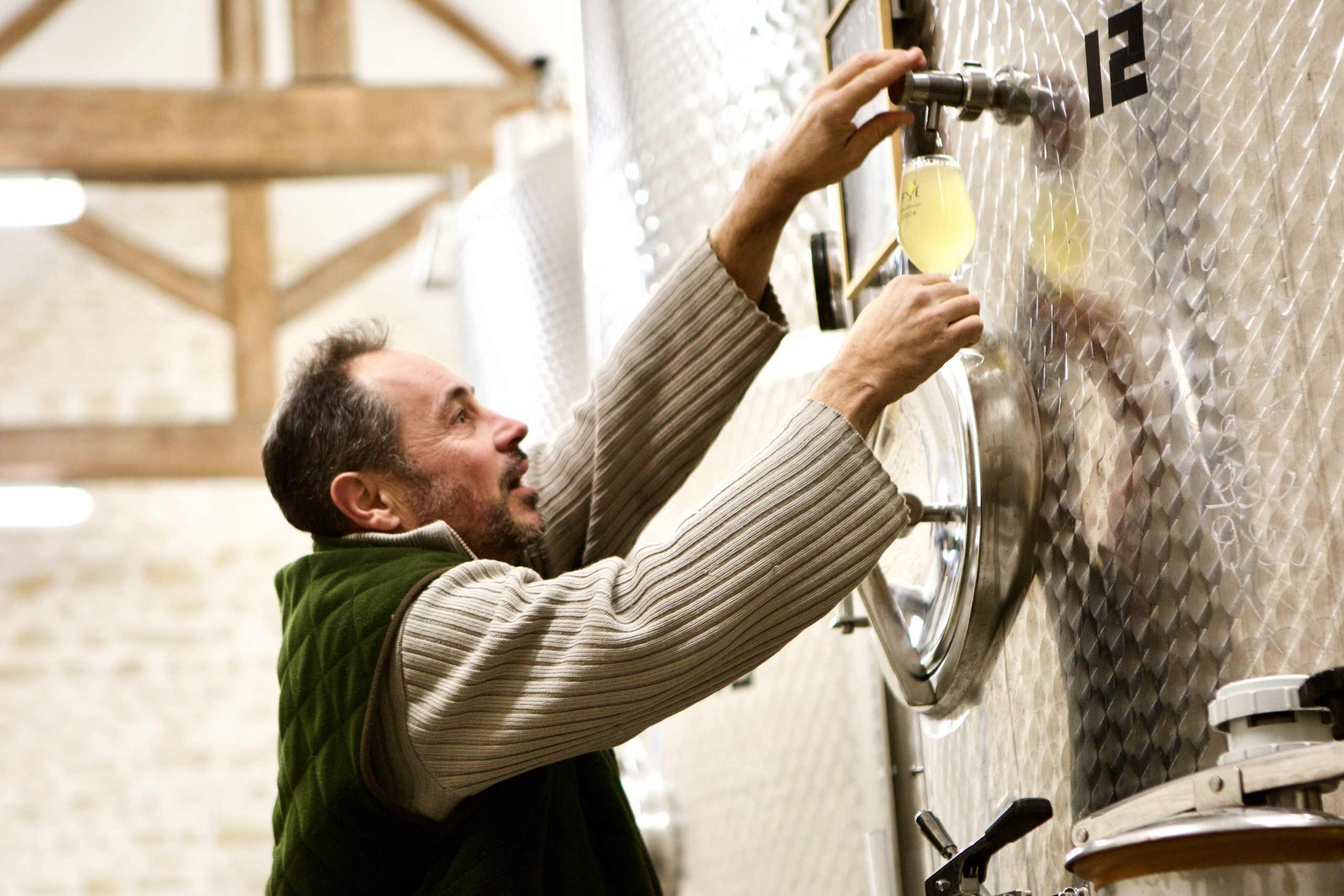 Christophe operating equipment in winery