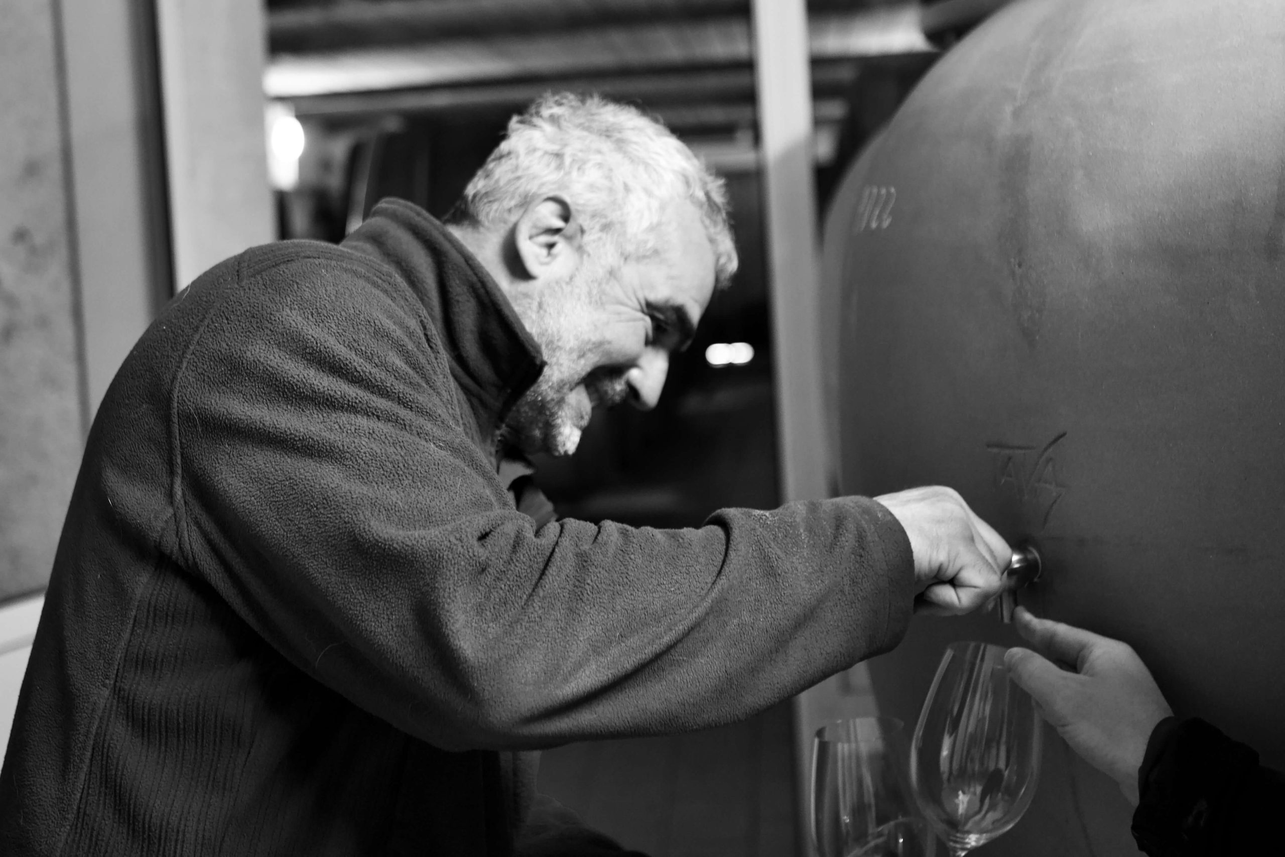 Jean-Marc using a wine dispenser