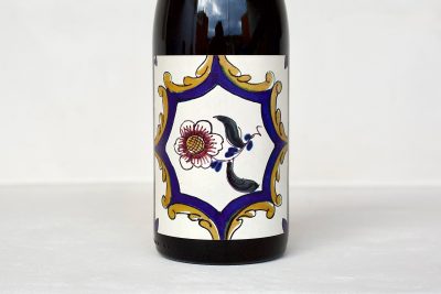 Vizinho Vinhateiro Dão Portuguese red wine bottle with traditional ceramic tile-inspired label