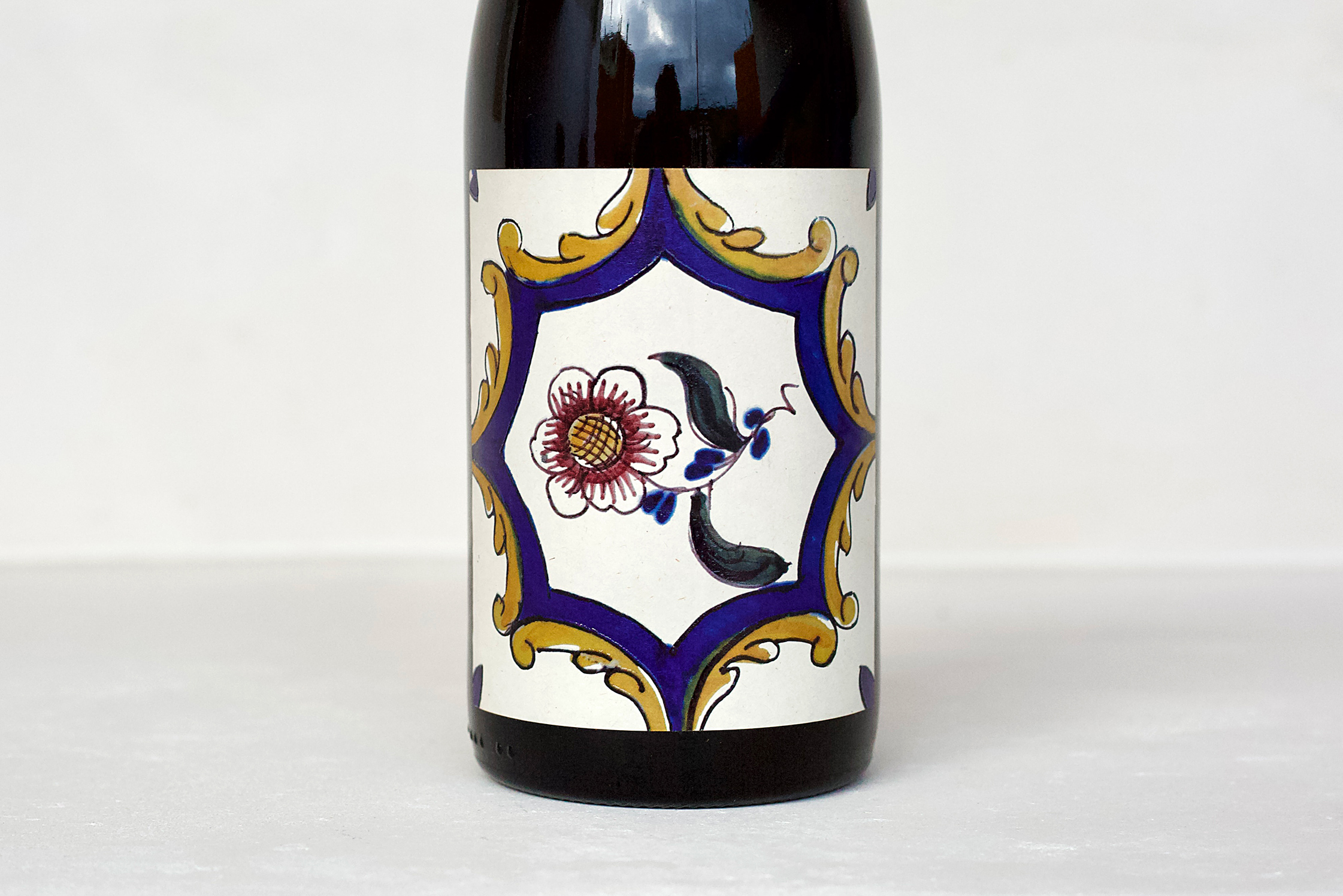 Vizinho Vinhateiro Dão Portuguese red wine bottle with traditional ceramic tile-inspired label