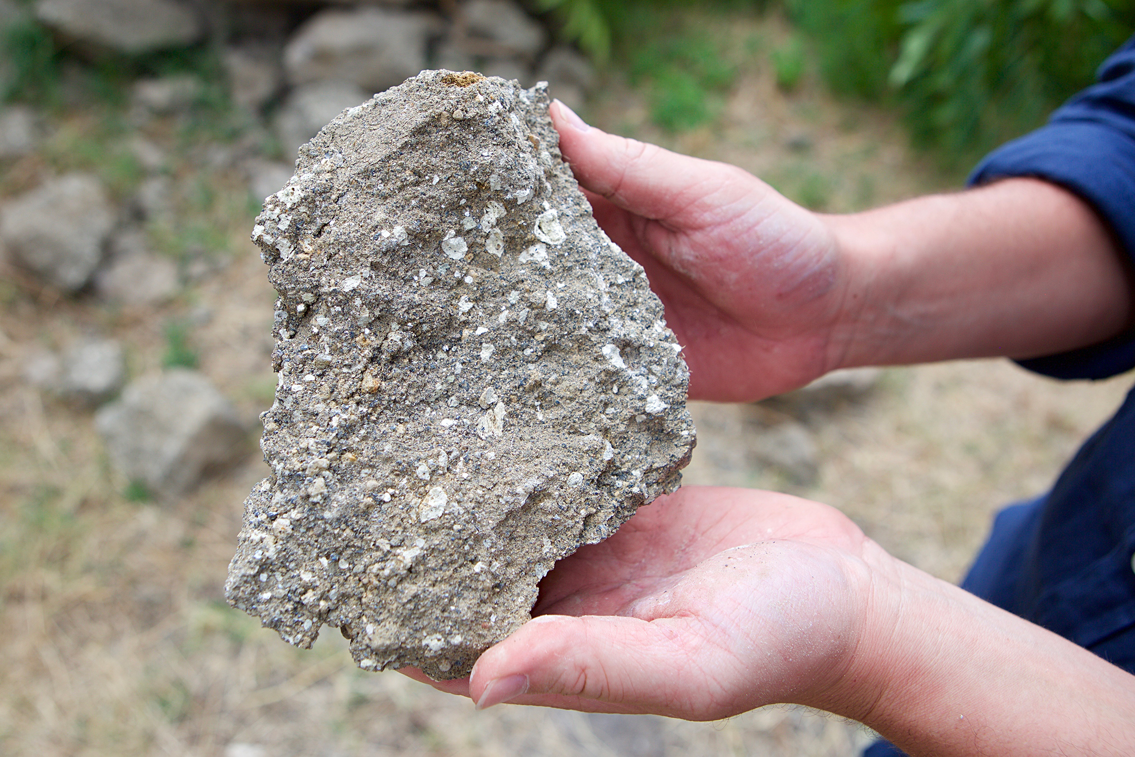 Paolo Latoracca holding a piece of volcanic tuff